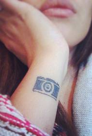 Girl arm small camera tattoo