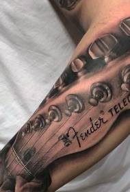 Arm very realistic guitar with hand letter tattoo pattern
