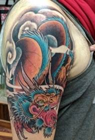 Beautiful full color dragon pattern tattoo on the big arm