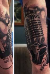 Arm black and white microphone with electric guitar tattoo pattern
