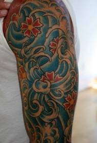 Red flowers and blue spray arm tattoo pattern