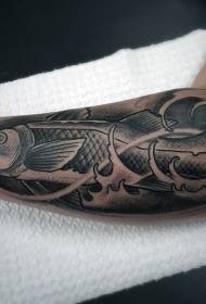 Black and white big fish tattoo pattern on the arm