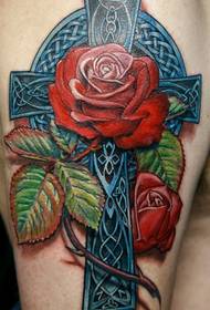 kaunis cross rose tatuointi käsivarressa