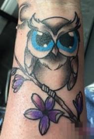 Painted flowers owl tattoo animal picture on arm