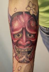 Red prajna tattoo on the arm