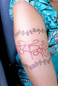 Arm colored arabesque tattoo pattern