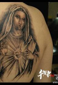 a classic tattoo of the Virgin on the back