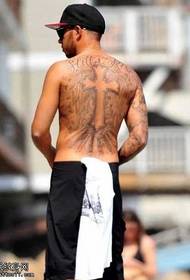 Lewis Hamilton behind the Christ tattoo pattern