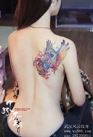 Phoenix tattoo on the right back of the beautiful woman