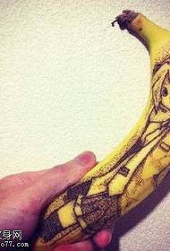 Little boy tattoo on banana