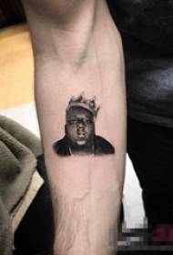Schoolboy arm on black point thorn crown and portrait tattoo picture