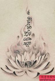 A beautiful black and gray lotus flower with a Sanskrit tattoo pattern