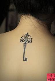 Girl's back a totem key tattoo pattern