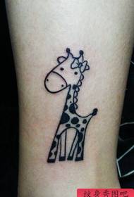 a totem giraffe tattoo pattern on the girl's leg