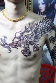 A mighty over-the-shoulder dragon tattoo that is loved by men