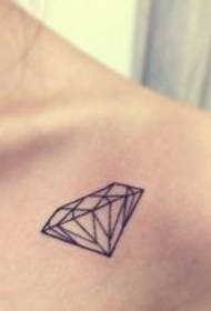 Beautiful small fresh diamond totem tattoo on the shoulder