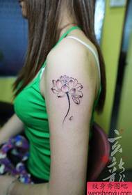 Girl's arm clear and popular ink lotus tattoo pattern