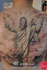 Male back with a tattoo of Jesus