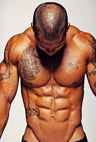 Muscular handsome guy with a domineering tattoo