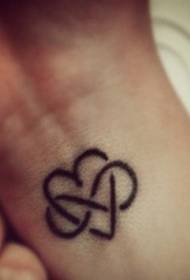 Female wrist love totem tattoo