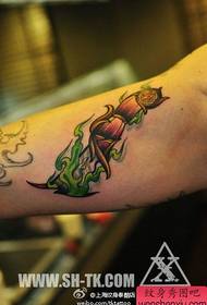 Cool and popular dagger tattoo on the inside of the arm