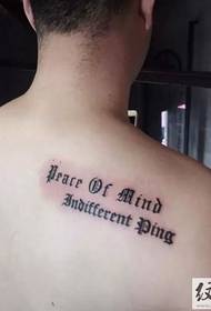 Simple English tattoo on the shoulders of men