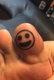 Toe tattoo, male toe, black smiley face tattoo picture