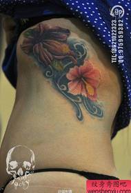 Beautiful woman's side chest only beautiful flower tattoo pattern