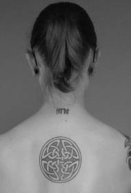 Elegant Celtic knot tattoo on the back of the girl