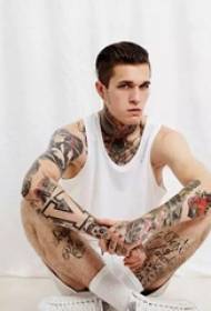 Handsome guy tattoos show the image of fashionable men
