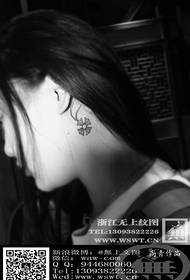 Lucky four-leaf clover tattoo behind the ear