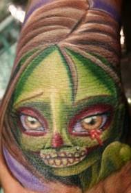 Colorful horrible female zombie tattoo pattern on the back of the hand