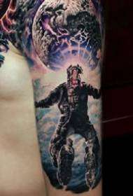 Tattoos of sci-fi-style cosmic starry aliens and other elements