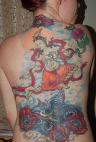 Girl's back painted dancing Buddha tattoo pattern
