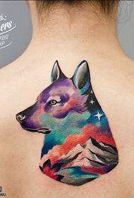 Wolf tattoo pattern on the back starry sky