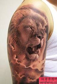 a domineering lion tattoo pattern on the arm