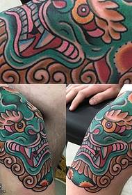 lion tattoo pattern on the knee