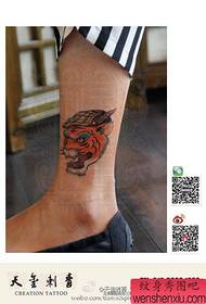 a popular tiger hat tattoo pattern for girls legs
