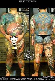 a cool man full body lion and squid tattoo pattern