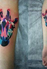 girls arm a giraffe tattoo pattern