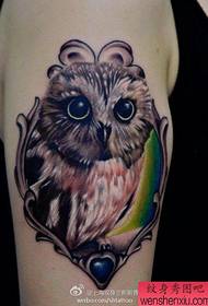 look at the realistic owl on the big arm Tattoo works
