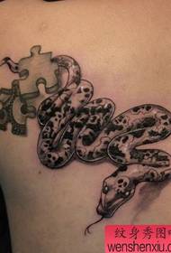 a black gray snake tattoo pattern on the shoulder