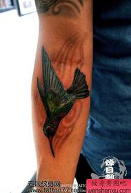 an arm hummingbird tattoo pattern