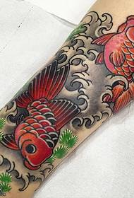 two goldfish tattoo designs on the calf