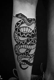 a snake tattoo pattern on the calf