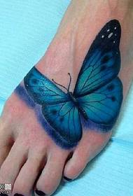 Pola tato kupu-kupu kaki biru
