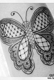 A stylish lace butterfly tattoo
