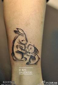 rabbit mother and baby tattoo pattern on the calf