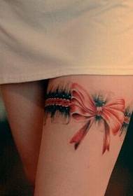 Tattoo with a bow on the leg