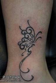 Patrón de tatuaje de tótem de mariposa de pierna